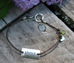 handcrafted sterling and leather messag bracelet